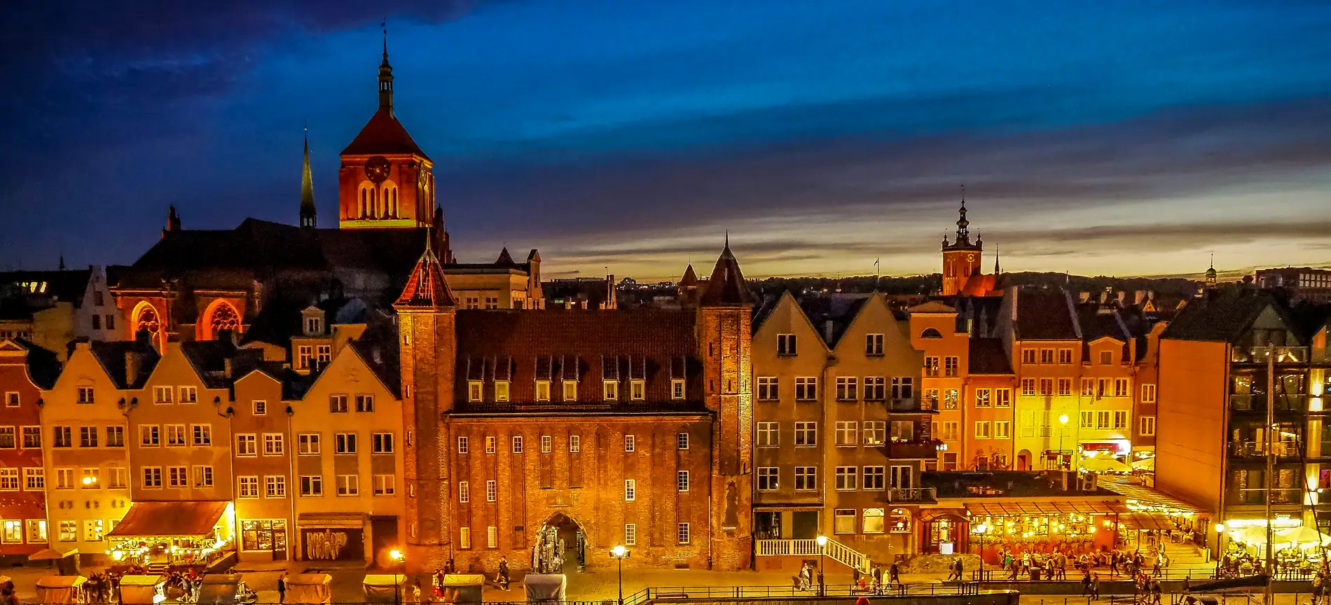 Gdańsk Old Town waterfront on the Motława at dusk — Taxi Airport Gdańsk, transfers from Gdańsk Lech Wałęsa Airport (GDN)